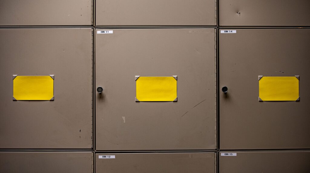 Rows of archive filing cabinets representing legacy candidate records selected for an ATS data migration